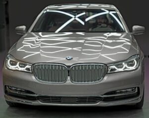 Elegant silver BMW with stylish light reflections, highlighting luxury and design.